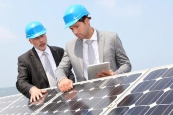 two engineers checking solar panels