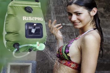 a girl smiles while bathing with a solar shower