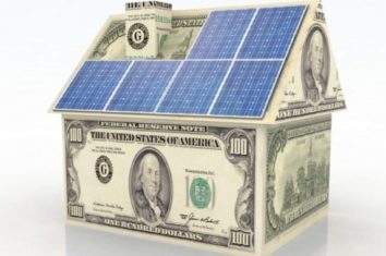 a small house made of solar panels and money