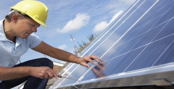 man checking on the status of his solar panels